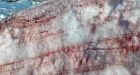 Italy's melting glaciers face new threat: Pink ice