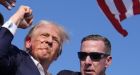 Trump escorted off stage after shots fired at rally
