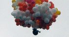 Priest tied to balloons disappears