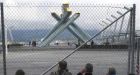 Bad weather, a fenced-off flame: It's one problem after another at a limping Olympics