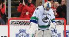 Canucks self-destruct in Detroit