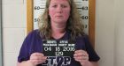 Woman wears 'stop domestic violence' in mugshot after arrest over confrontation with husband